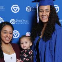 A future alumna poses with family at GradFest